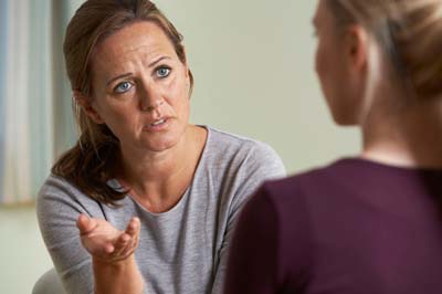 What-happens-to-our-house-in-a-divorce women discussing what happens to the house in a divorce
